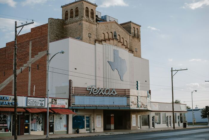 Old Texas theater building on a quiet street, representing common truths people were fooled into believing propaganda.