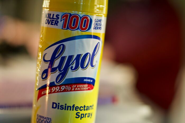 Close-up of Lysol disinfectant spray bottle highlighting germs and bacteria k**l claims related to strange health hacks.