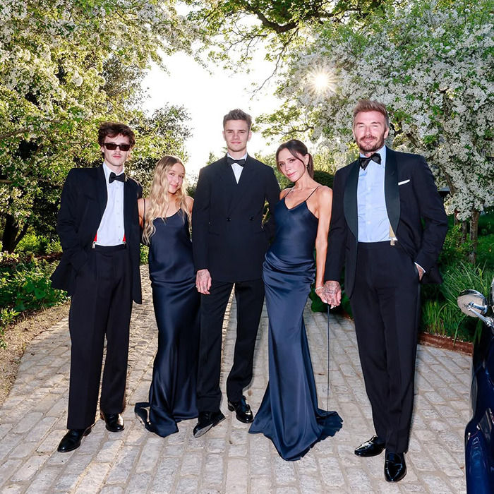 David Beckham and family dressed elegantly outdoors, highlighting the very creepy relationship controversy in public view.
