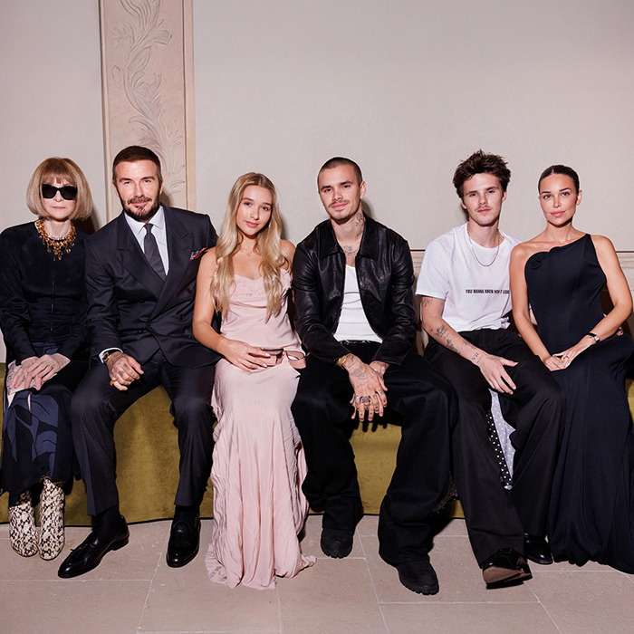 David Beckham with family and friends seated, highlighting the very creepy relationship concerns around his daughter.