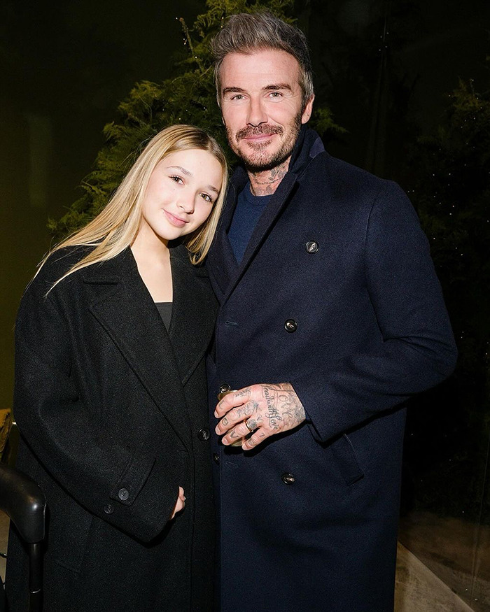David Beckham and his daughter posing together outdoors at night, sparking discussion about their very creepy relationship.