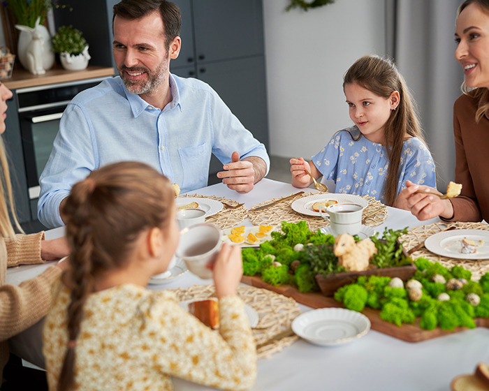 Family dinner scene with dad and children at table, highlighting moments before discovering shocking texts with teacher.