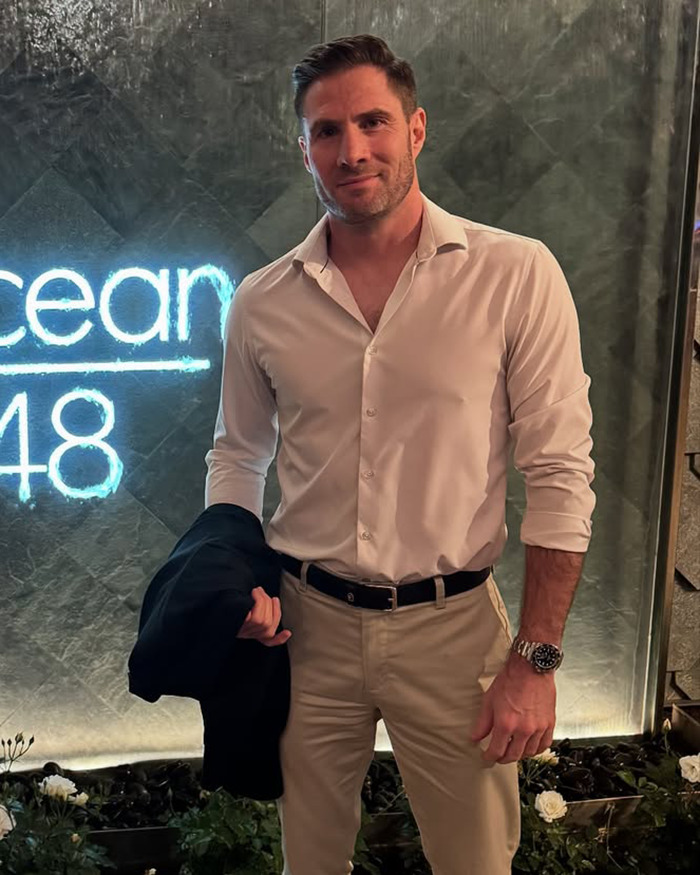 Man in white shirt and beige pants posing indoors, related to doctor's avocado hands warning viral after ER visits.