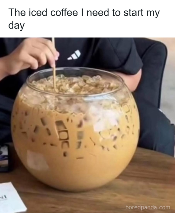Person stirring an enormous glass of iced coffee, a relatable meme about coping with anxiety and daily struggles.