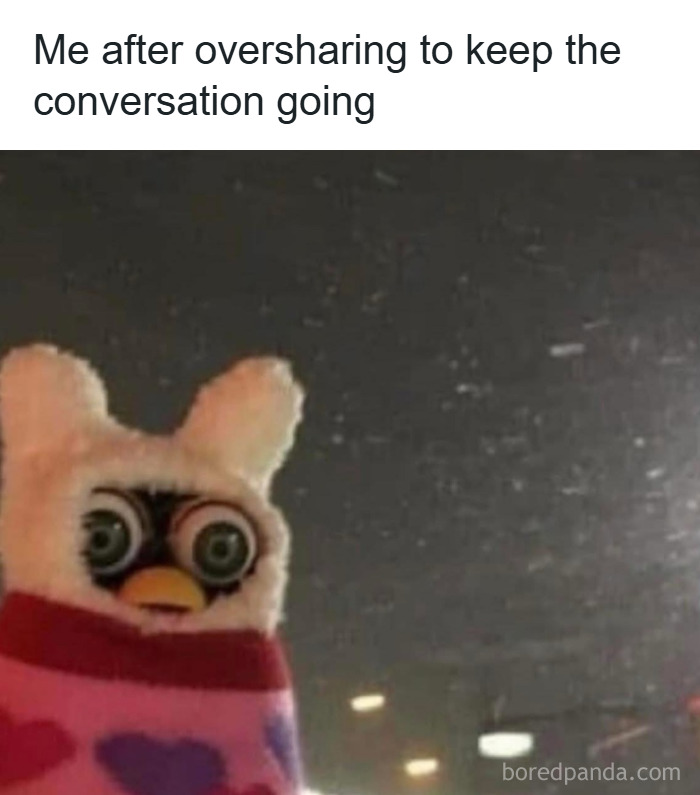 A wide-eyed toy in a colorful outfit illustrating relatable memes about coping with anxiety through oversharing conversations.