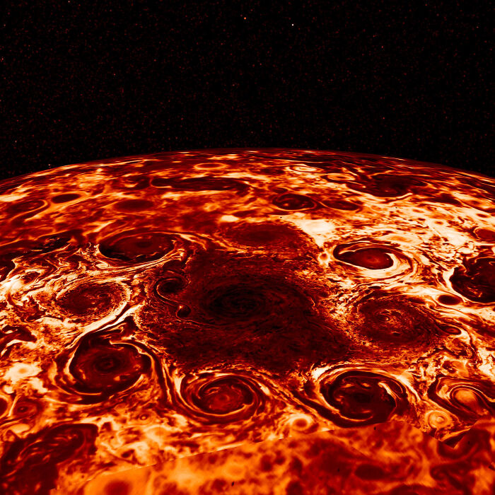 Close-up astronomy photo of swirling storm patterns on a distant planet showing the beauty and mystery of space.