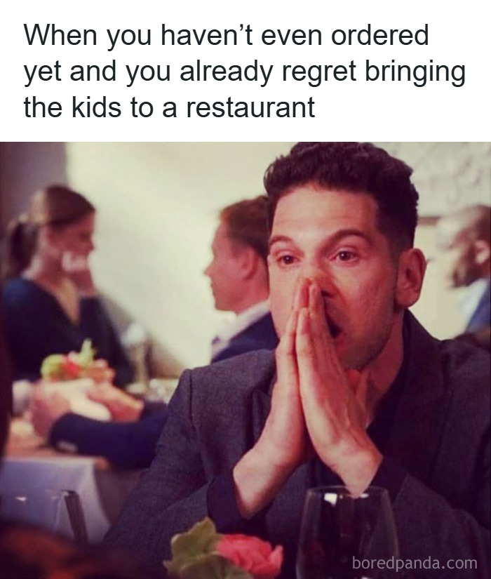 Man looking stressed and overwhelmed at a restaurant, relatable parenting meme about regretting taking kids out before ordering.
