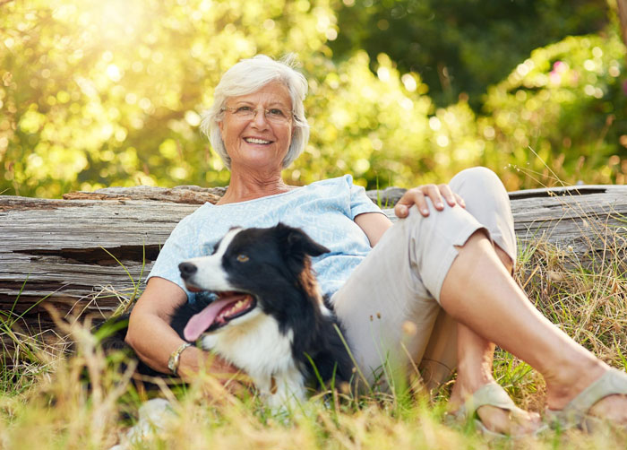 Elderly lady sitting outdoors with dog, owner in shock over alleged plan to steal neighbor&rsquo;s doggo.