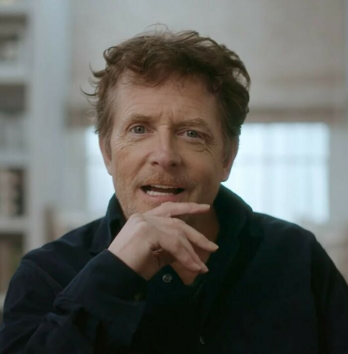 Michael J. Fox sharing a heartbreaking update on his health during an emotional and candid conversation indoors.