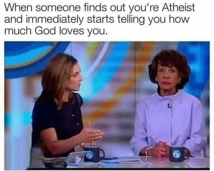 Two women in a talk show setting with a caption about atheism and being told how much God loves you, related to fight the patriarchy posts.