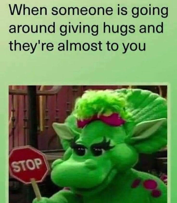 Green puppet holding a stop sign with text about anxiety and hugs, a relatable meme for coping with anxiety.