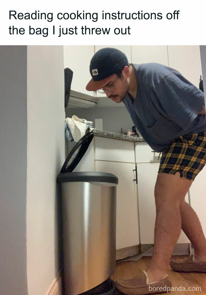 Man reading cooking instructions from trash can lid in a kitchen, humorous meme related to memes for you to laugh at.