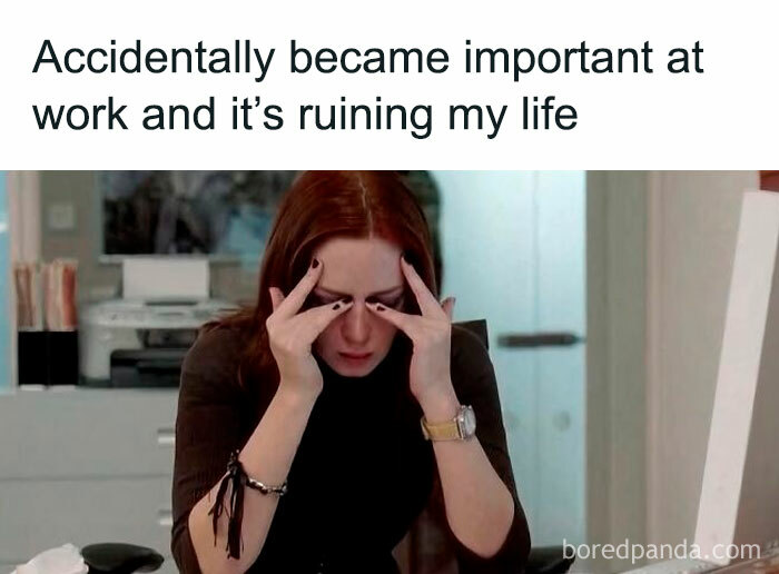 Woman stressed at work holding her head, illustrating the struggle of becoming important in workplace memes for laughs.