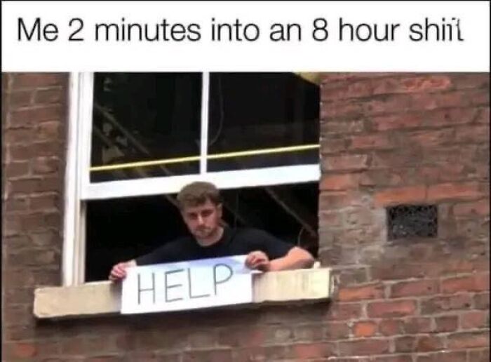 Man holding a sign that says HELP at a window, illustrating humor in memes about long work shifts.