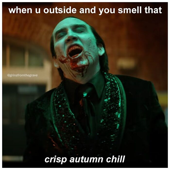 Vampire character with bloody mouth laughing, captioned about smelling crisp autumn chill in horror movie meme.