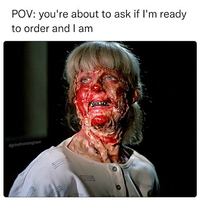 Woman with gruesome horror makeup grinning widely, featured in a funny horror movie meme about being ready to order.