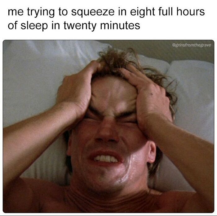 Man in bed holding his head in frustration, illustrating a hilarious horror movie meme about lack of sleep.