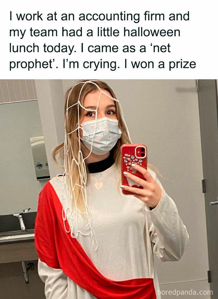 Woman wearing a mask and homemade net prophet costume sharing cringy jokes and puns for dads in an office Halloween setting.