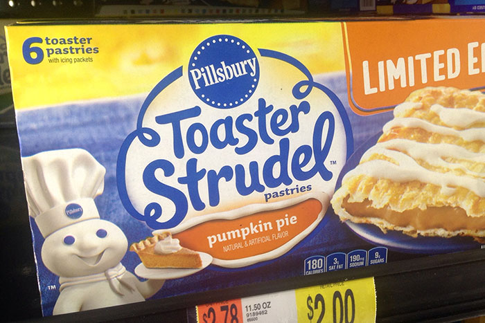 Pillsbury Toaster Strudel pumpkin pie pastries box with chef mascot showing a slice, limited edition packaging.