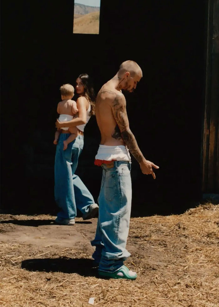 Hailey Bieber wearing casual jeans holding a child, avoiding run-in with Selena Gomez at Academy Museum Gala.