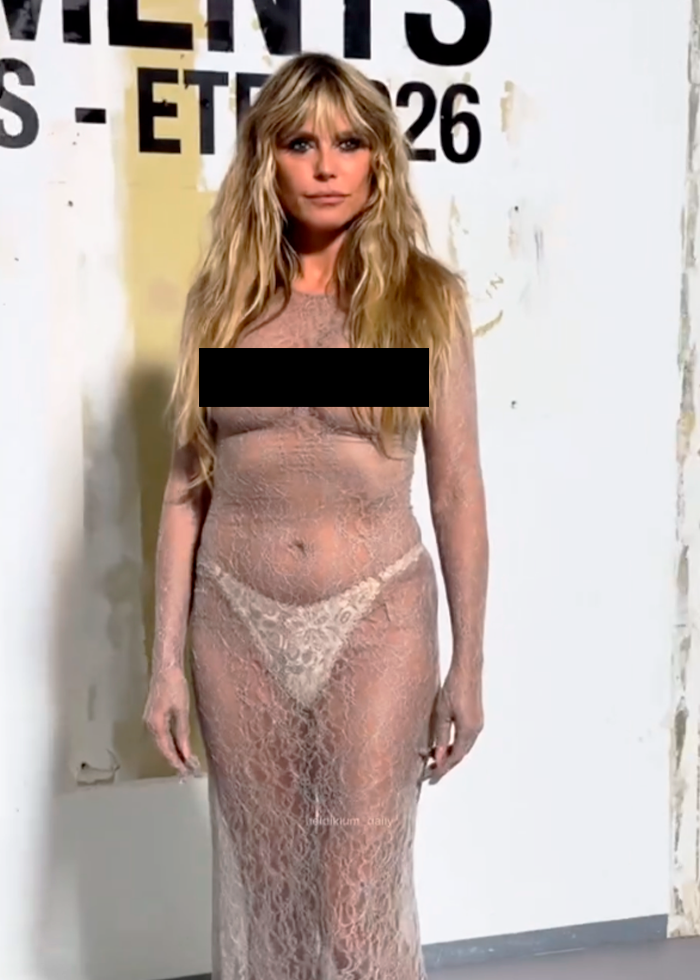 Heidi Klum wearing a fully sheer dress with thong, showcasing a bold look at the Vetements Paris fashion show.