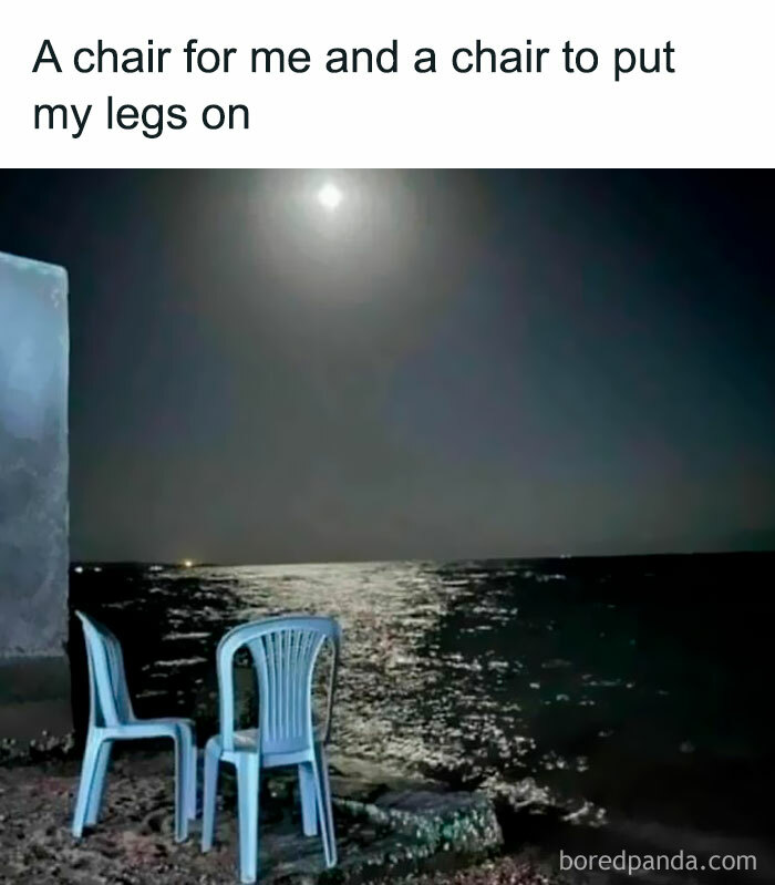 Two empty chairs by the water at night, illustrating relatable memes to take your mind off work stress.