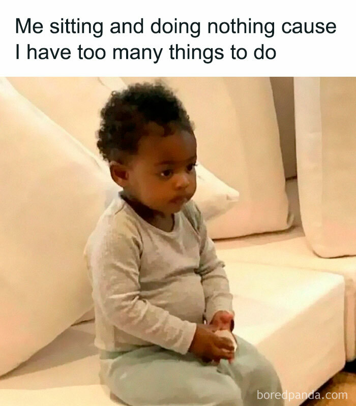 Toddler sitting still on a couch looking overwhelmed, representing hilarious and relatable memes about having too much work.
