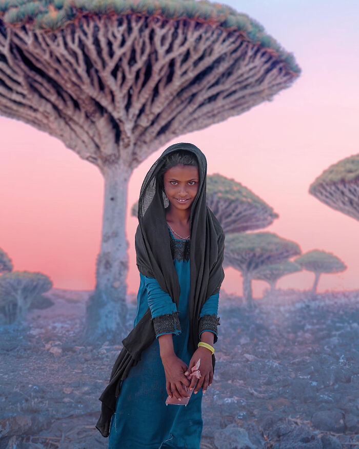 Local Girl On Background Of Dragon Trees