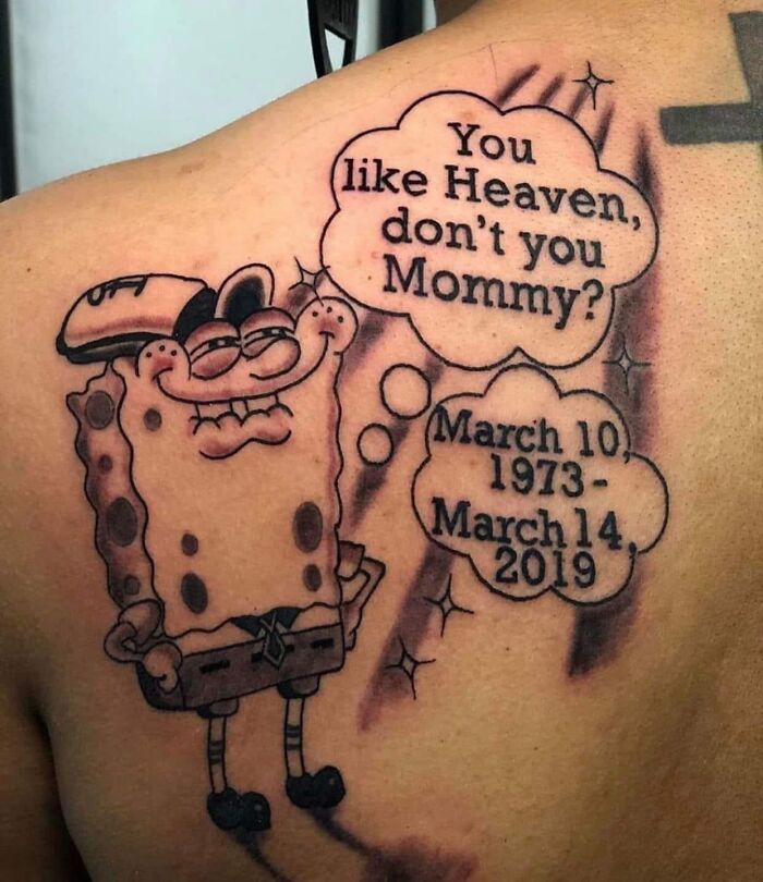Tattoo of a distorted cartoon character with text bubbles, showcasing a strange and controversial tattoo artists design.