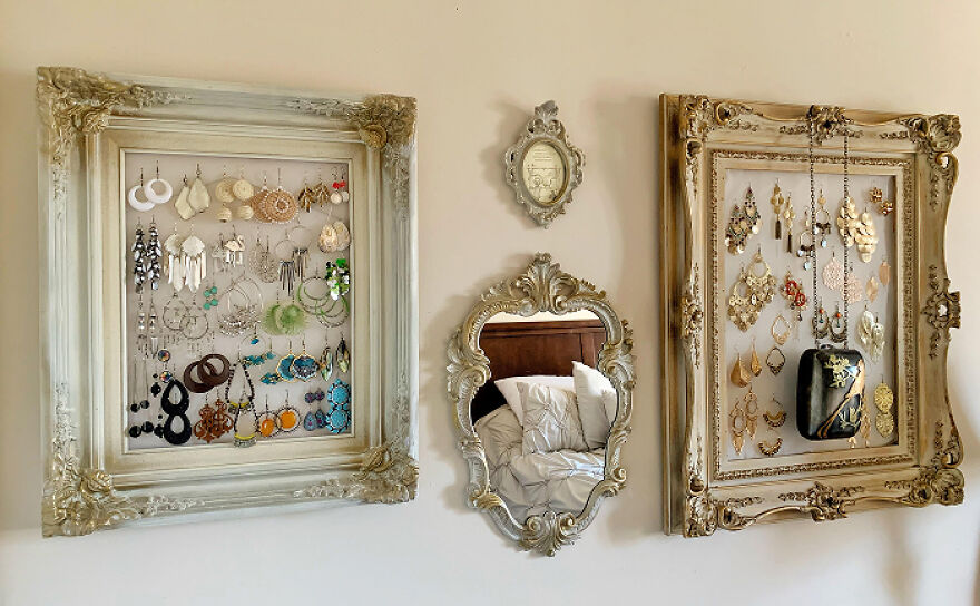 Decorative frames used as organization hacks displaying earrings and jewelry for a stylish home storage solution.