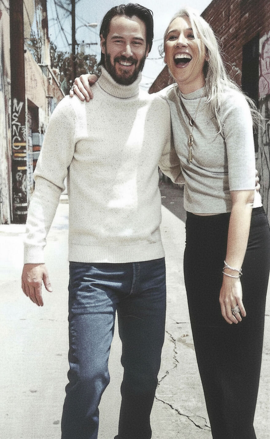 Keanu Reeves And Alexandra Grant walking outdoors in casual clothes, representing Hollywood’s enduring power couples.