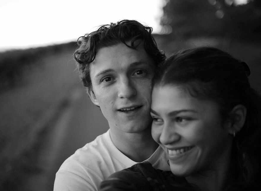 Zendaya And Tom Holland smiling together outdoors, capturing the essence of Hollywood’s most enduring power couples.