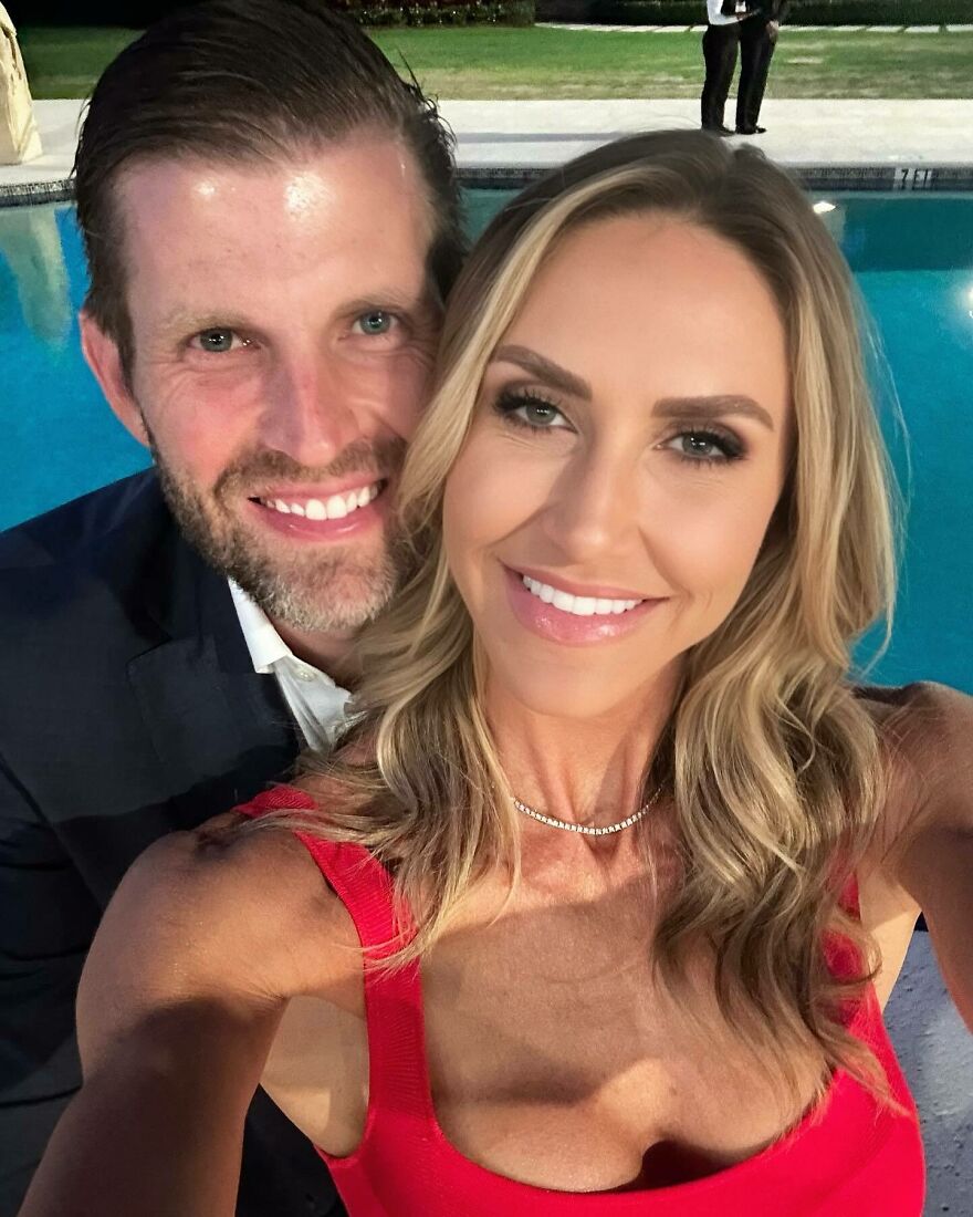 Lara Trump smiling with a man by the pool, showcasing her early years to MAGA star transformation in a selfie.