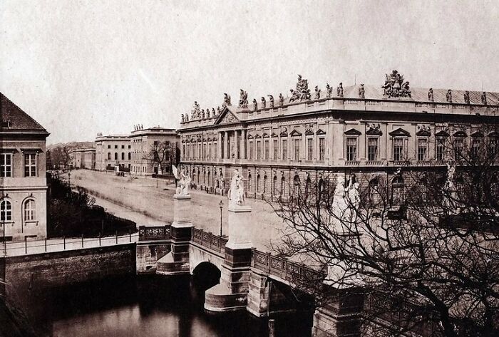 Historic photo of a world capital showcasing architecture and street views from before modern times.