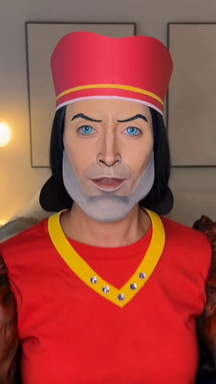 Creative Cliche showcasing amazing Halloween makeup with detailed costume and face painting in a vibrant red outfit and hat.