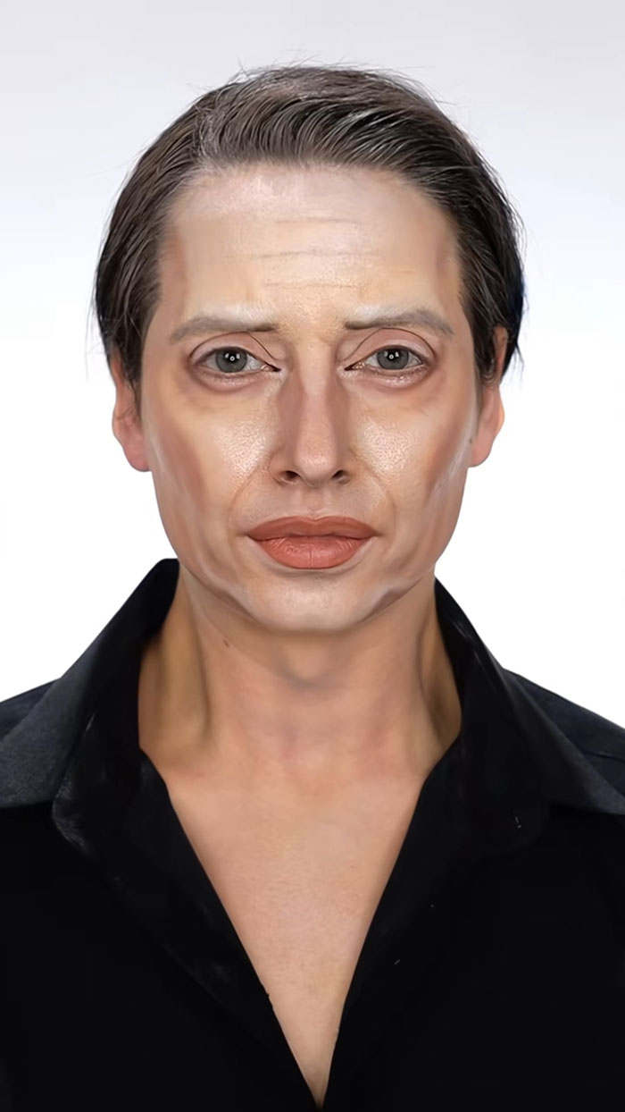 Person with detailed Halloween makeup showing realistic aging effects, demonstrating creative Halloween makeup skills.