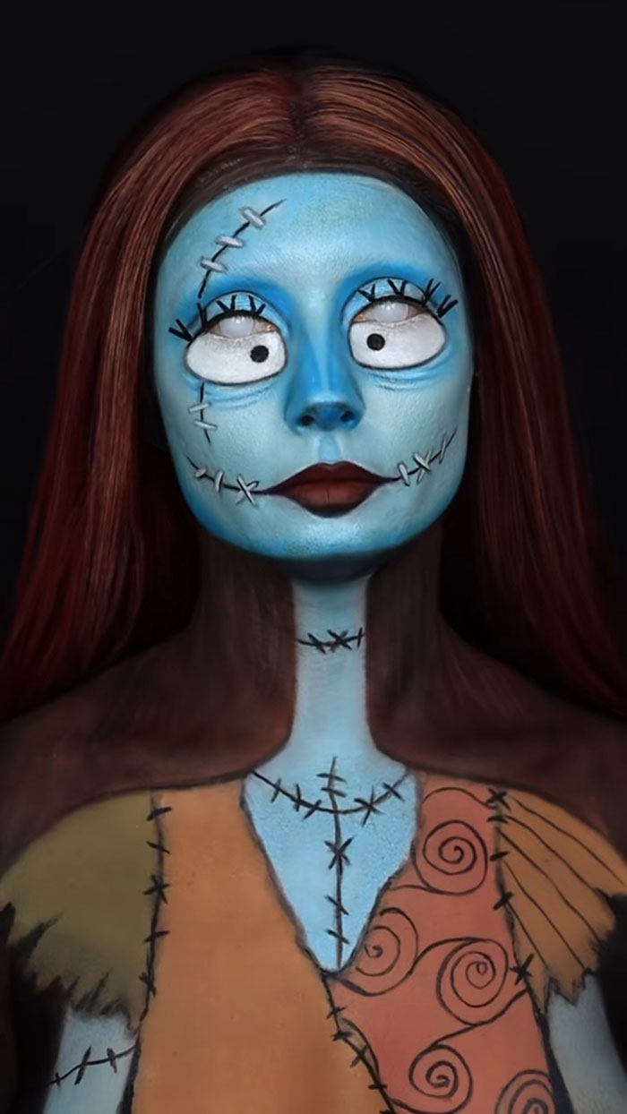 Creative Halloween makeup inspired by a stitched doll character, showcasing detailed face and body paint artistry.