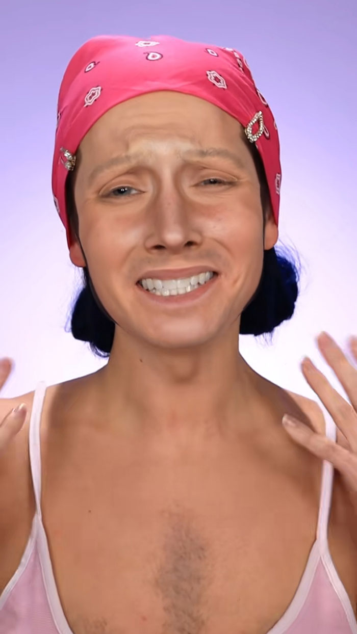 Person wearing a pink bandana showing detailed Halloween makeup with creative facial shading and highlights.