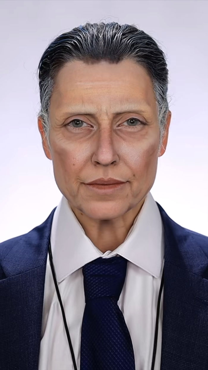 Close-up of detailed Halloween makeup by Creator Creative Cliche, transforming face with realistic aging effects and formal attire.