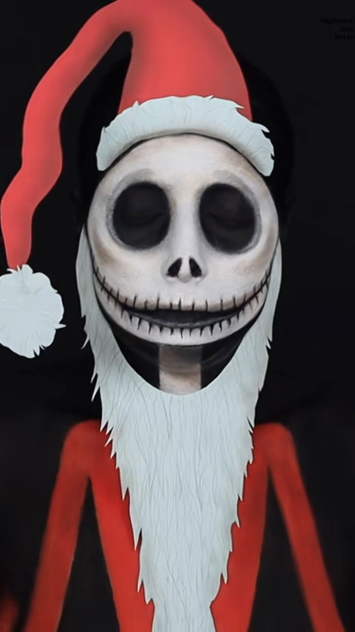 Halloween makeup art showing a creative skeleton face with a Santa hat and white beard on a dark background.