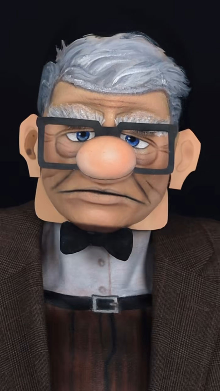 Creative cliche Halloween makeup transforming face into an animated elderly man character with glasses and gray hair.