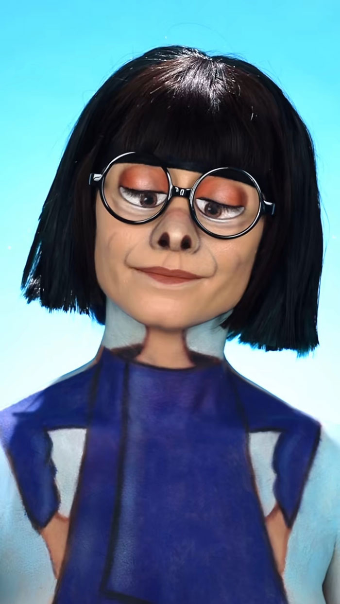 Creative Cliche Halloween makeup with detailed face paint and costume, featuring glasses and a blue outfit against a bright background.