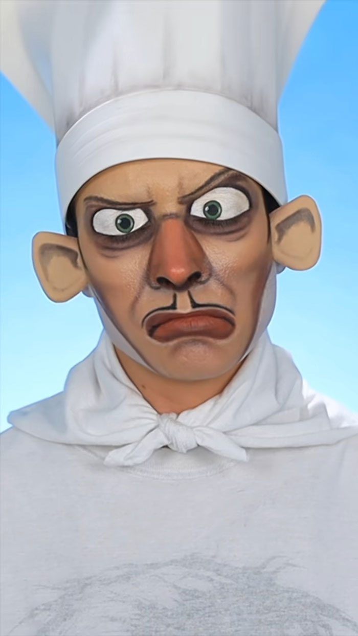 Person wearing amazing Halloween makeup with exaggerated cartoonish chef features against a blue sky background