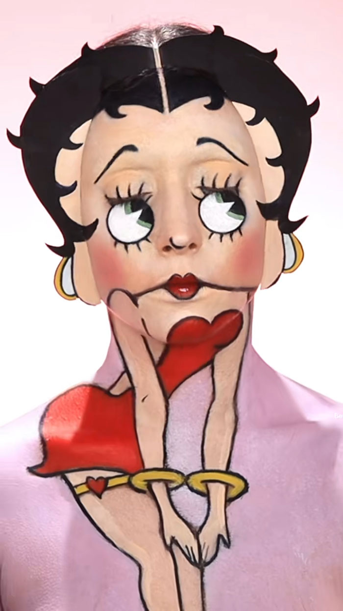 Creative Cliche Halloween makeup transforms a face into a cartoon character with detailed and vibrant body paint art.