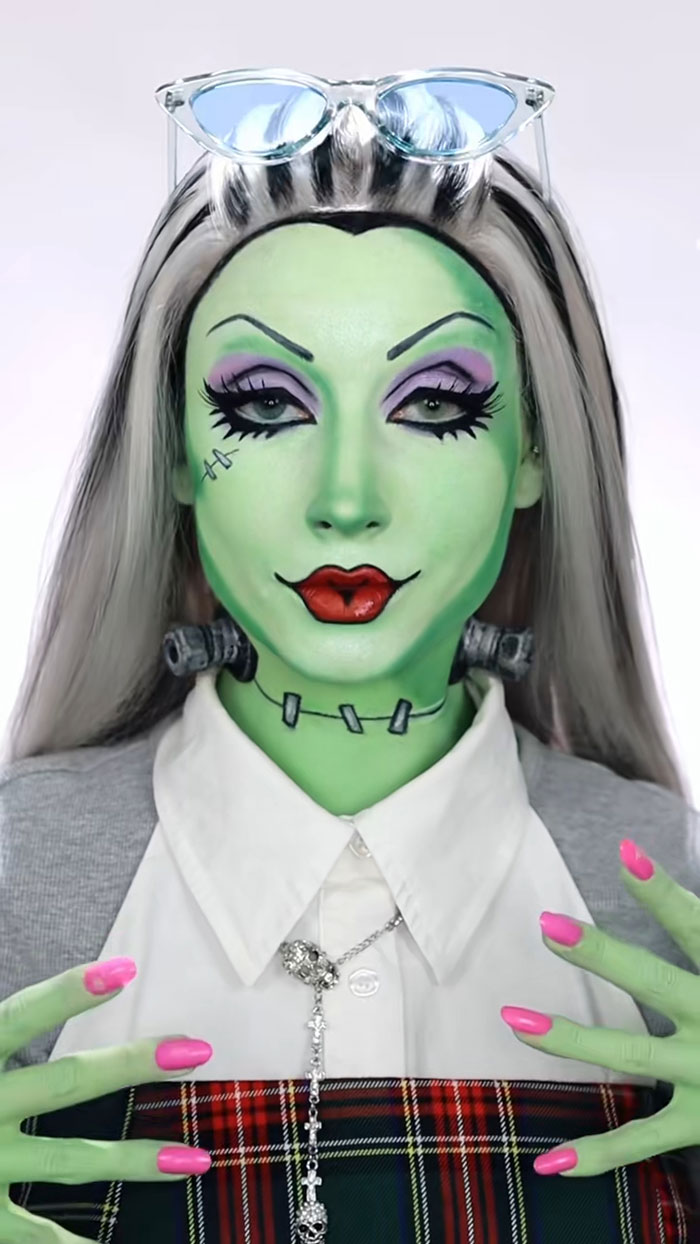 Creative Cliche showing amazing Halloween makeup with green face paint, detailed eye makeup, and styled gray hair.