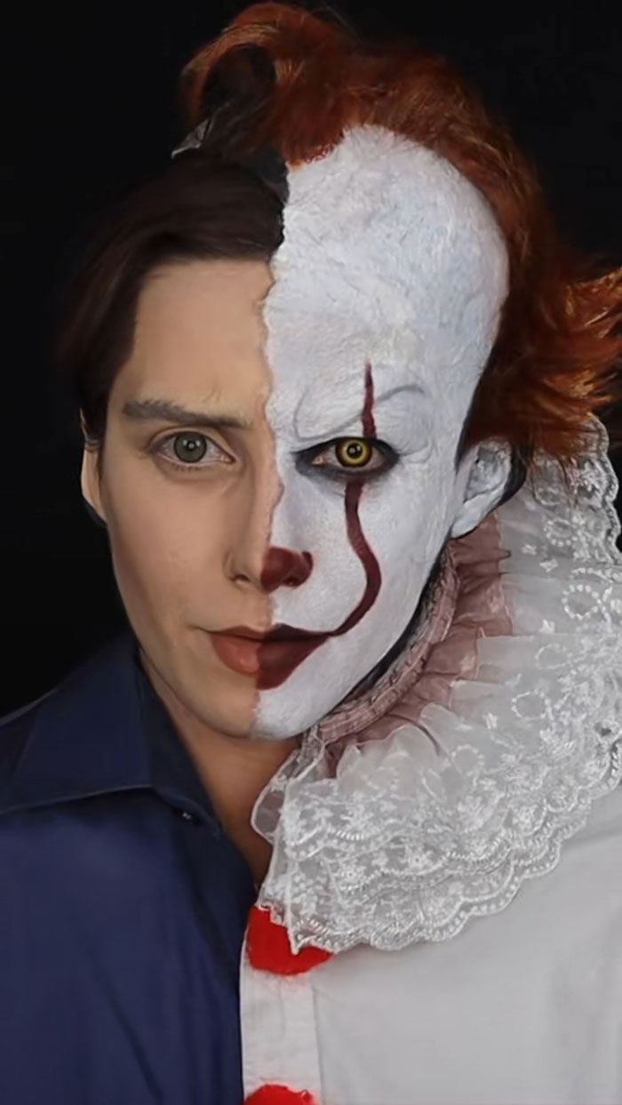 Half face portrait showing creative Halloween makeup transforming a person into a scary clown with white face paint and red hair.