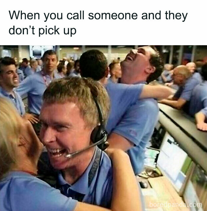 Call center employees laughing and hugging, representing introvert memes about socializing and decompressing after calls.