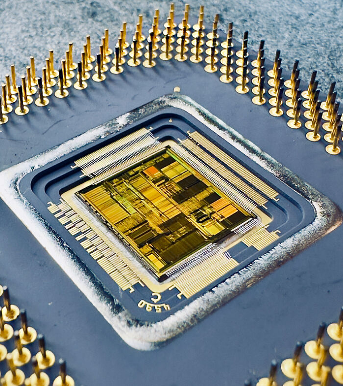 Close-up microscopic image of a microchip highlighting intricate details from the Nikon Small World photomicrography contest.