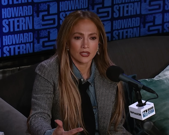 Jennifer Lopez speaking on Howard Stern show, addressing accusations from her ex-husband in a heated interview.