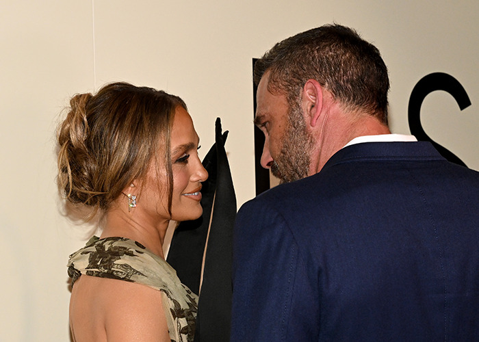Jennifer Lopez and Ben Affleck cozy up on the red carpet causing rage and confusion from fans at the event.